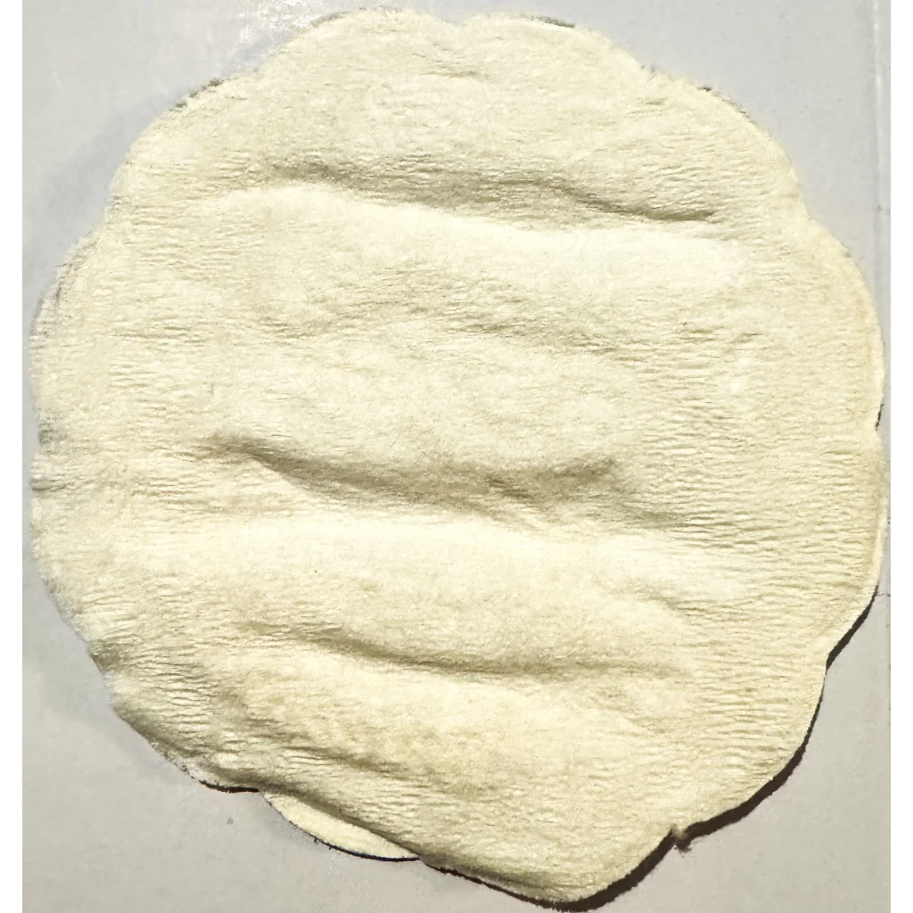 Circular raw dough with texture on a Rare Vintage 1950s Herman Jansen Coaster