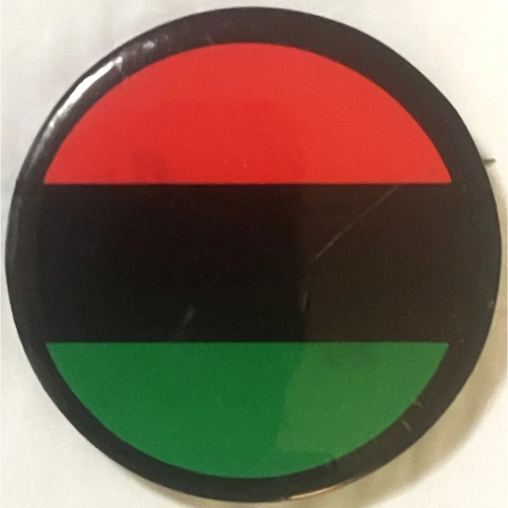 Rare vintage 1960s Malcolm X pin with red, black, and green stripes for civil rights