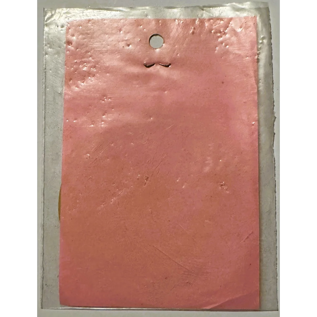 Textured pink paint sample featuring the Embla Crest from rare vintage 1960s Rotary International decal