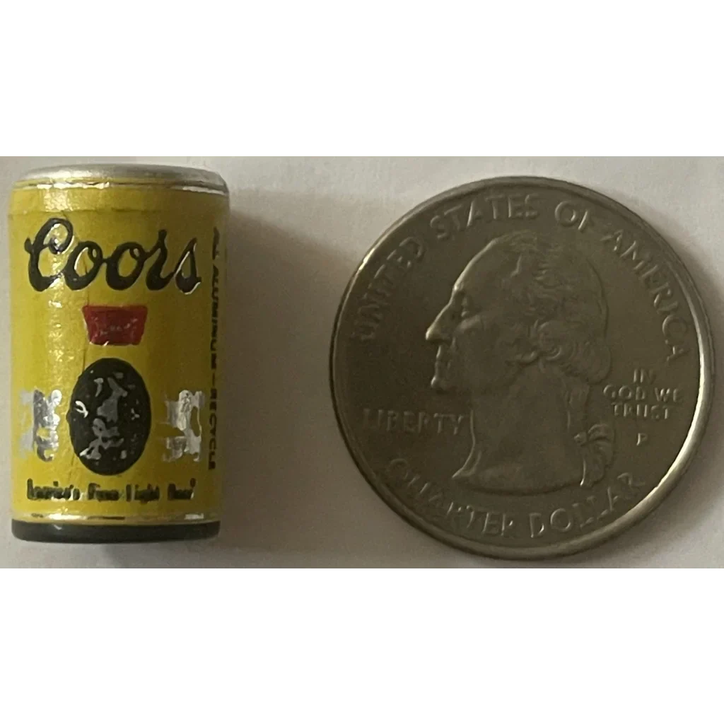 Miniature Coors beer can next to a quarter for size, a cool 1970s mini collectible