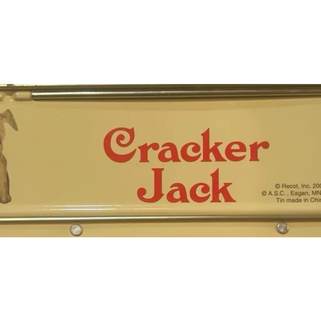 Vintage metal sign for Cracker Jack on a cool collectible lunchbox