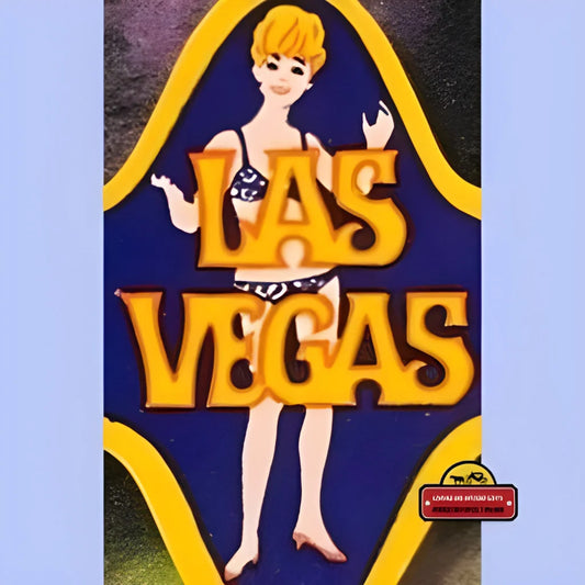 Retro Las Vegas sign with showgirl showcases vintage Las Vegas 1970s glam vibes