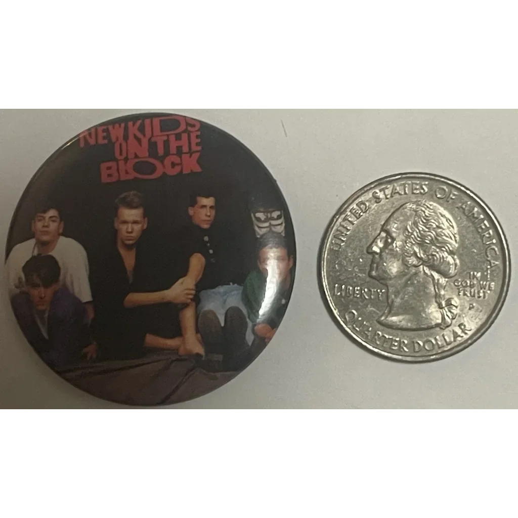 Circular vintage NKOTB pin showcasing classic band image for ’80s music nostalgia