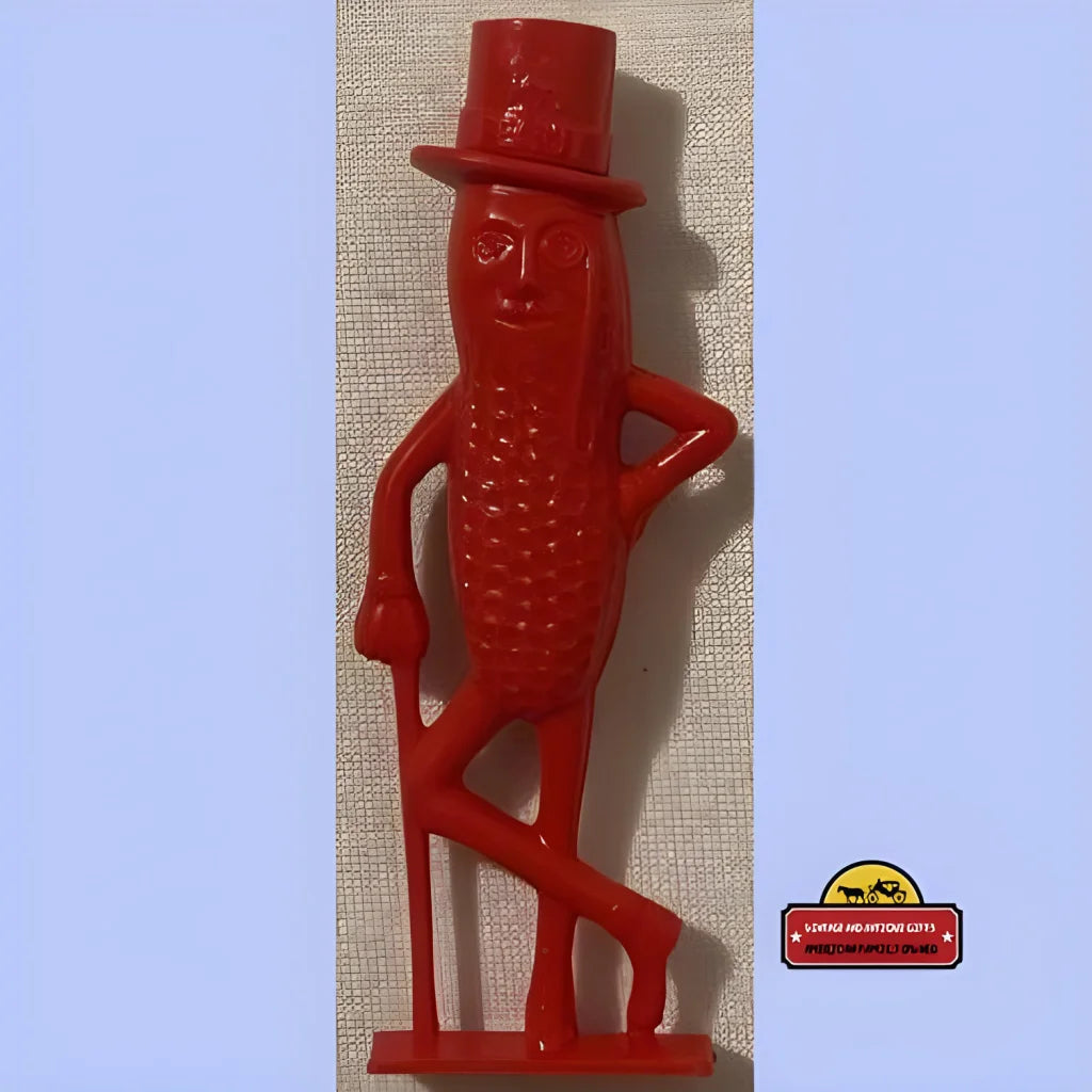 Red plastic Mr. Peanut figurine with top hat and cane for vintage Planters peanut whistle collectible