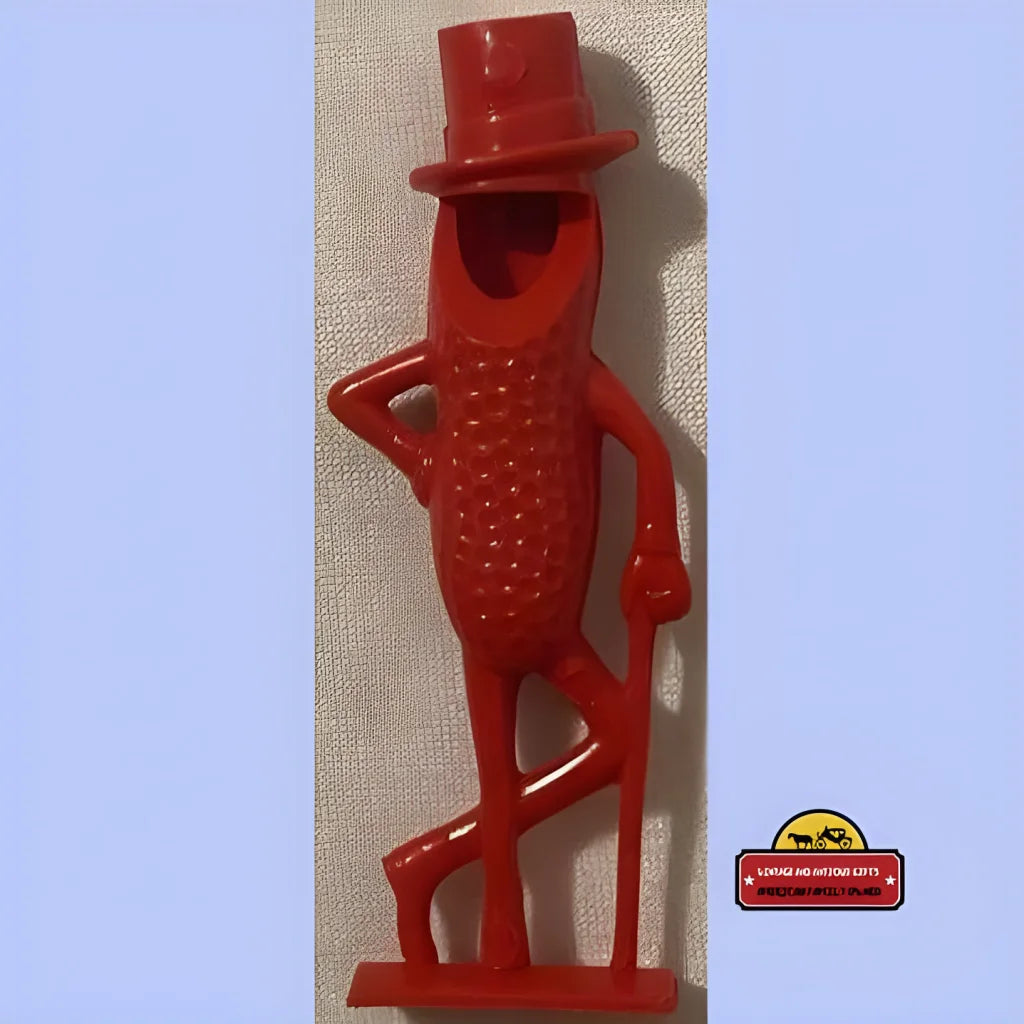 Red plastic Mr. Peanut figurine with top hat, perfect for vintage Planters peanut whistle fans