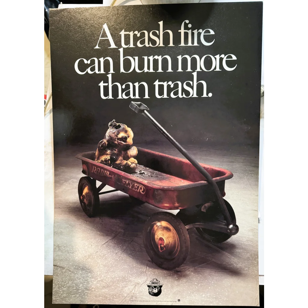 Burnt teddy bear in red wagon from rare vintage Smokey Bear forest service poster