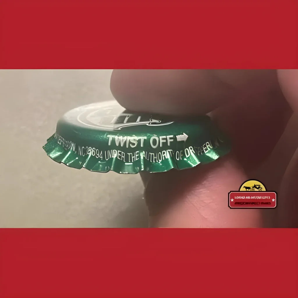 Green bottle cap with TWIST OFF text and arrow from a 1980s Sun Drop bottle