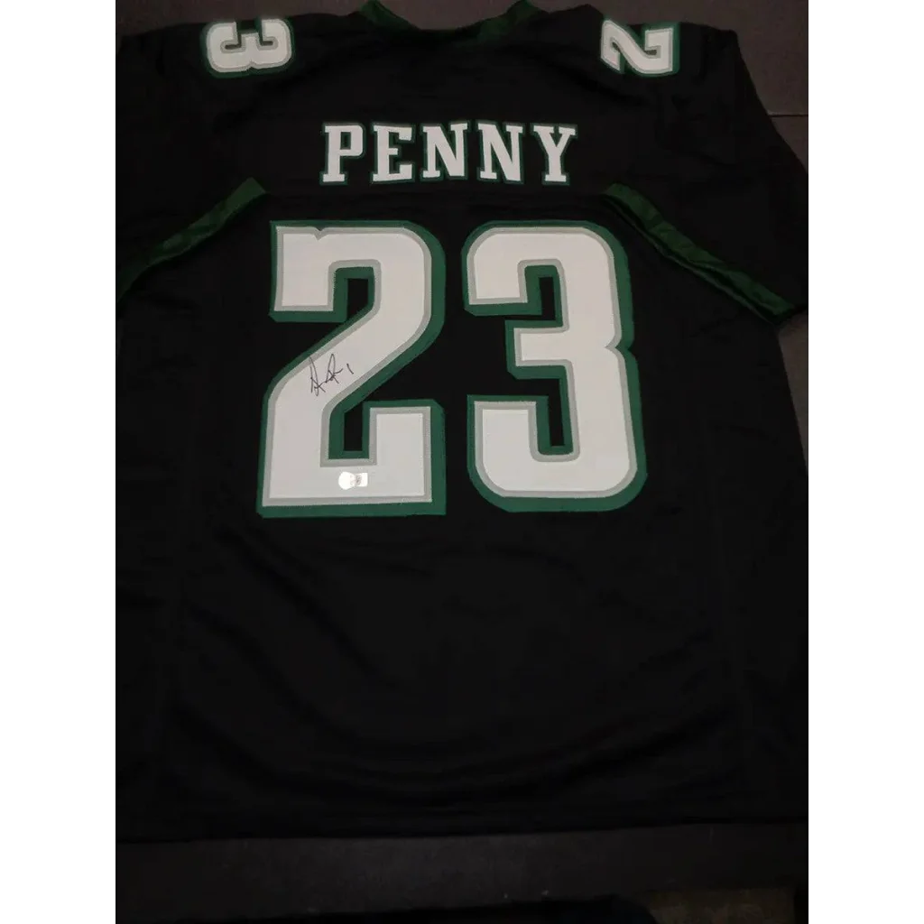 Black Philadelphia Eagles jersey with Rashaad Penny autograph and Beckett hologram sticker