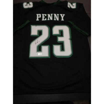 Black Philadelphia Eagles jersey with Rashaad Penny autograph and Beckett hologram sticker