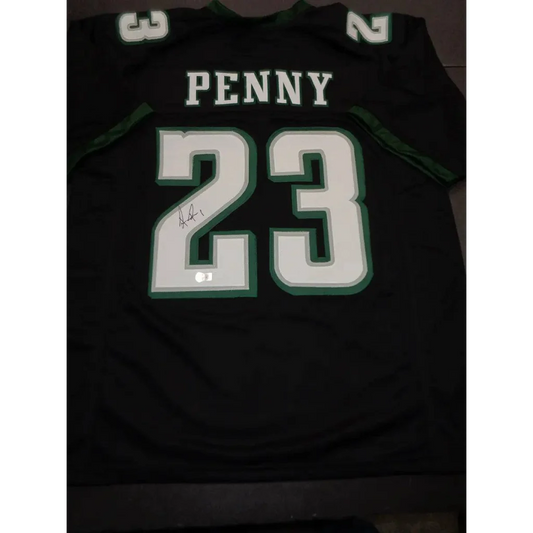 Black Philadelphia Eagles jersey with Rashaad Penny autograph and Beckett hologram sticker