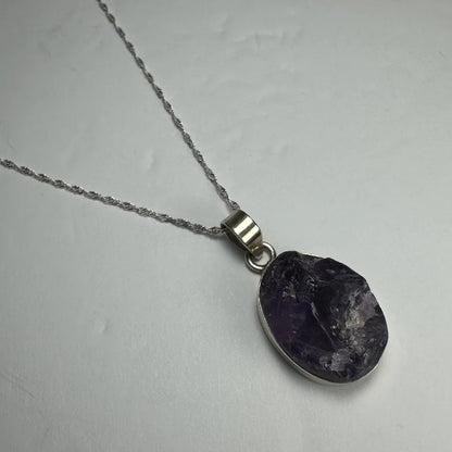 Raw oval amethyst pendant in sterling silver necklace