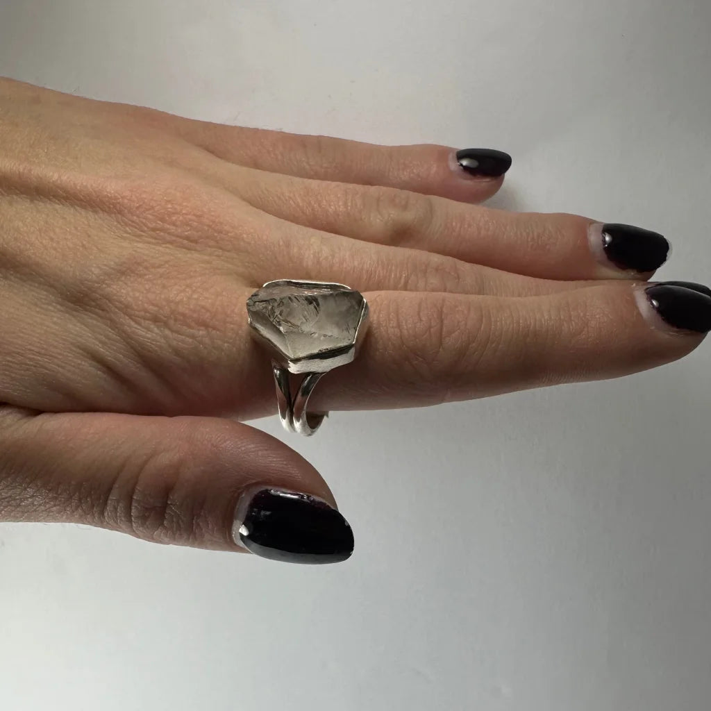 Silver raw quartz ring with faceted stone and geometric band