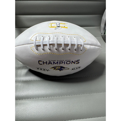 White Baltimore Ravens commemorative football with yellow stitching and laces, Ray Lewis signed team logo