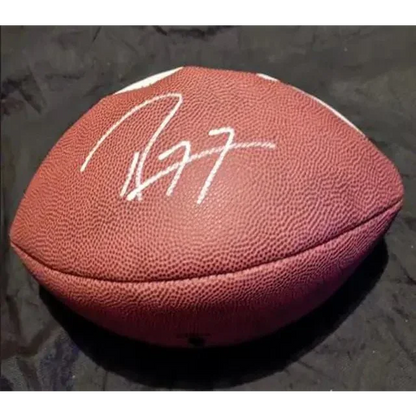 Autographed brown leather American football with Ray Lewis signed team logo design