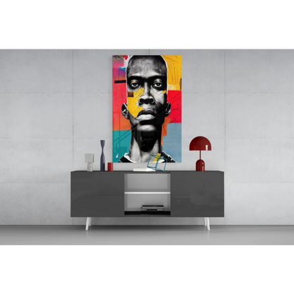 Bold geometric face glass wall art canvas in vibrant yellow, red, teal blocks on black-and-white portrait