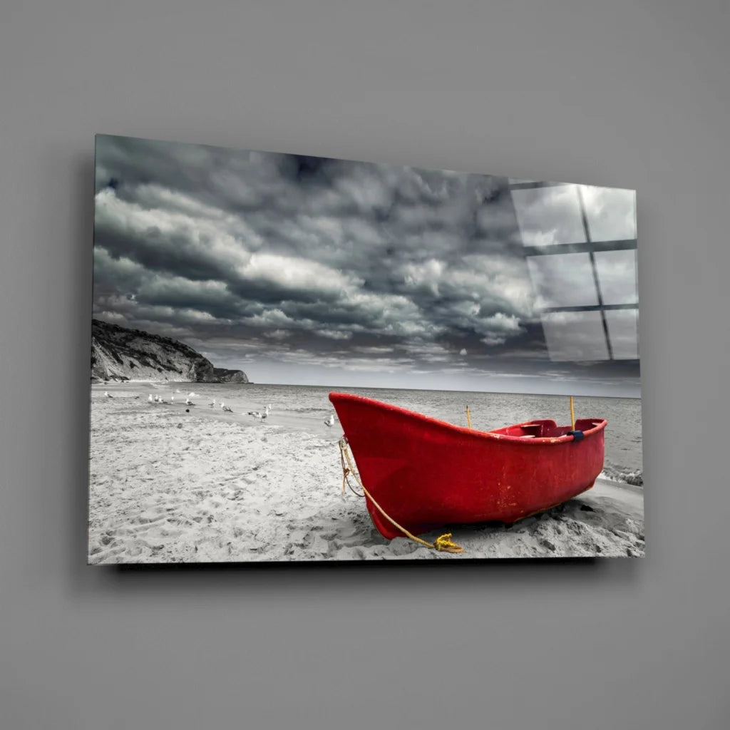 Red rowboat on beach under stormy sky wall art print