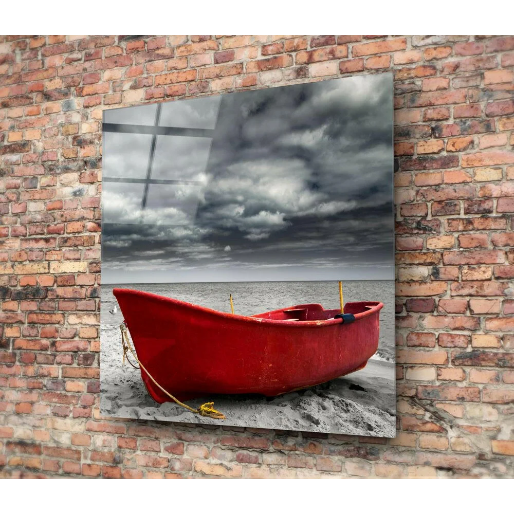 Red rowboat on stormy beach glass wall art print