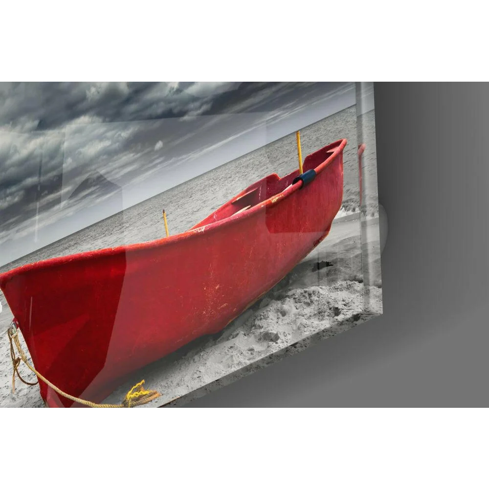 Vibrant red rescue boat on sandy beach in stormy skies, glass wall art print