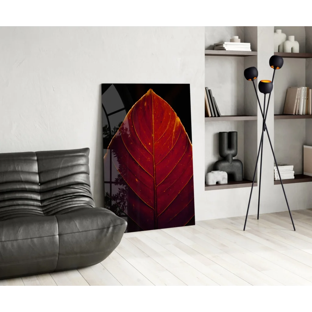 Vibrant red leaf glass wall art with golden veins on dark background
