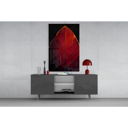 Vibrant red leaf glass wall art with golden veins on black background