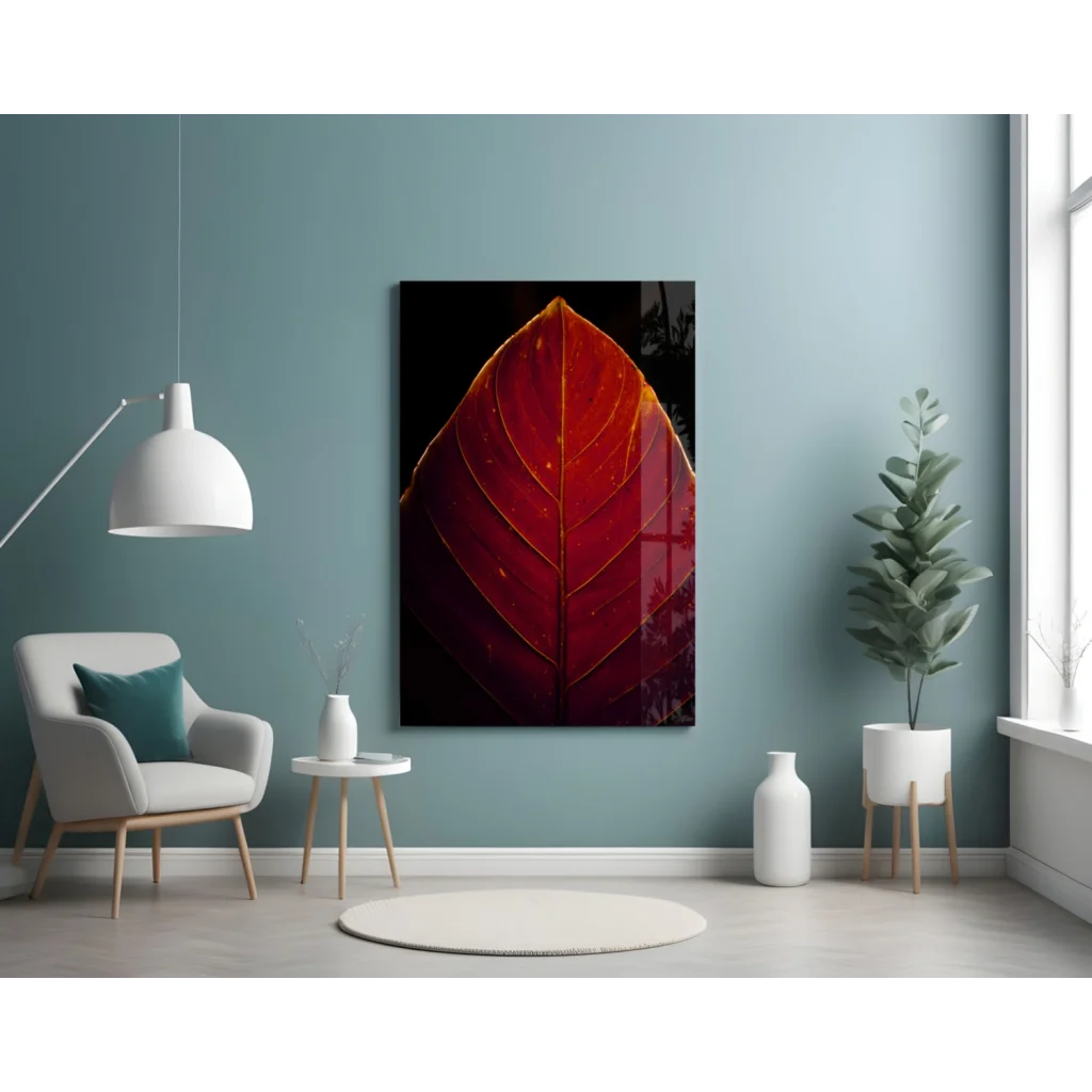 Vibrant red leaf glass wall art with golden veins on black background
