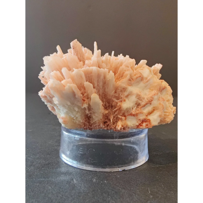 Red mordenite specimen 100g pale peach crystalline mineral on acrylic stand