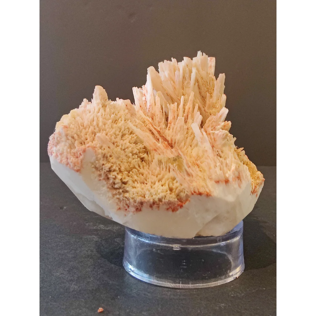 Red mordenite specimen 298g with white orange spiky crystals on stand