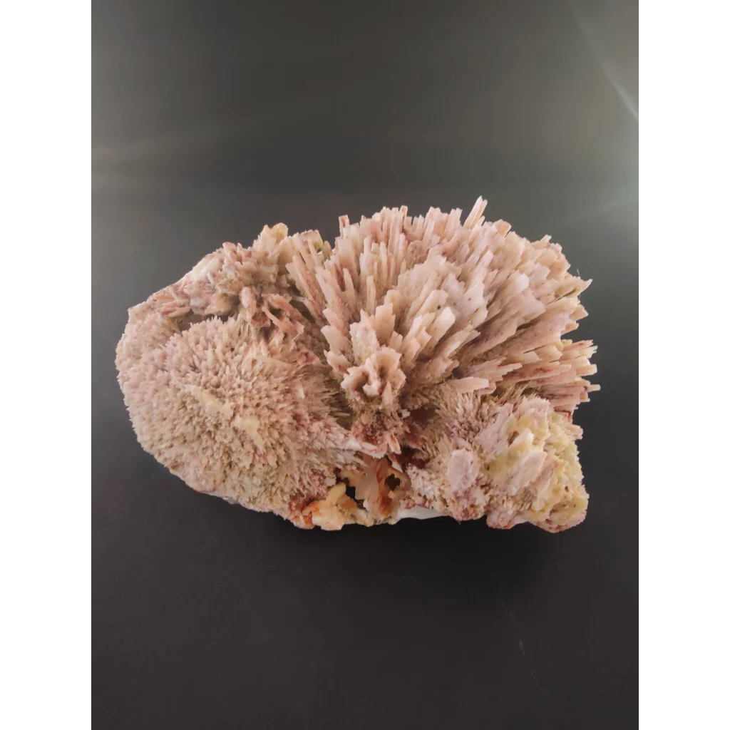 Red mordenite specimen 393g with pink needle-like crystals on earthy base
