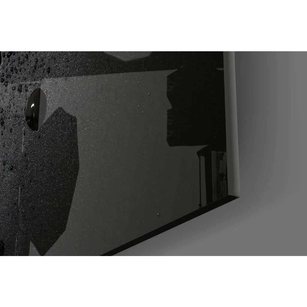 Black glossy glass wall art with speckled reflective mirror texture