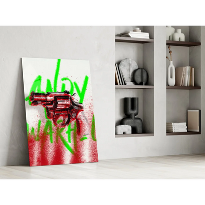 Red revolver graffiti glass wall art on white canvas with green text