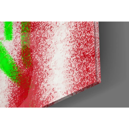 Vibrant red revolver graffiti on glass wall art canvas with green splatters