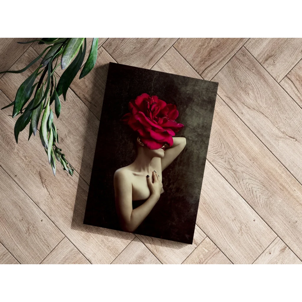 Red rose canvas art print with gold chain detail on wooden floor