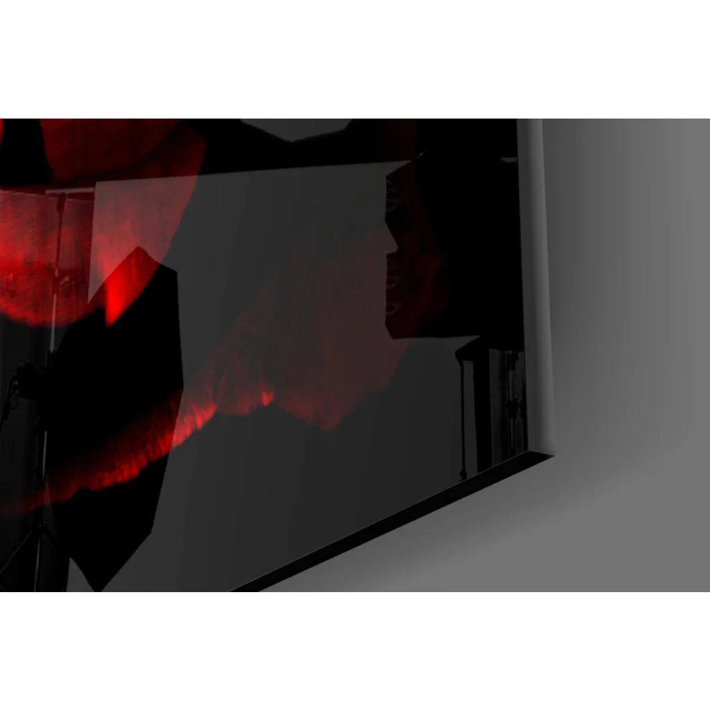 Sleek black frame monitor reflecting red rose wall art on dark gray screen