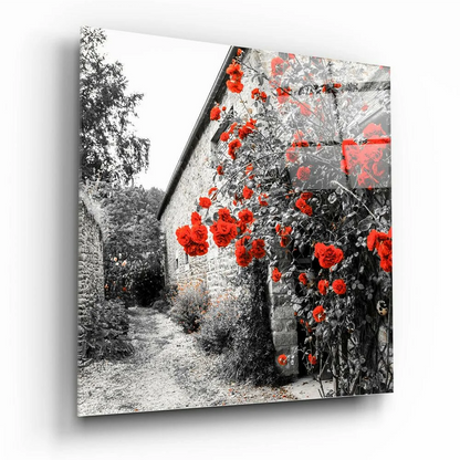 Rustic stone cottage wall art print with red roses on monochrome garden backdrop