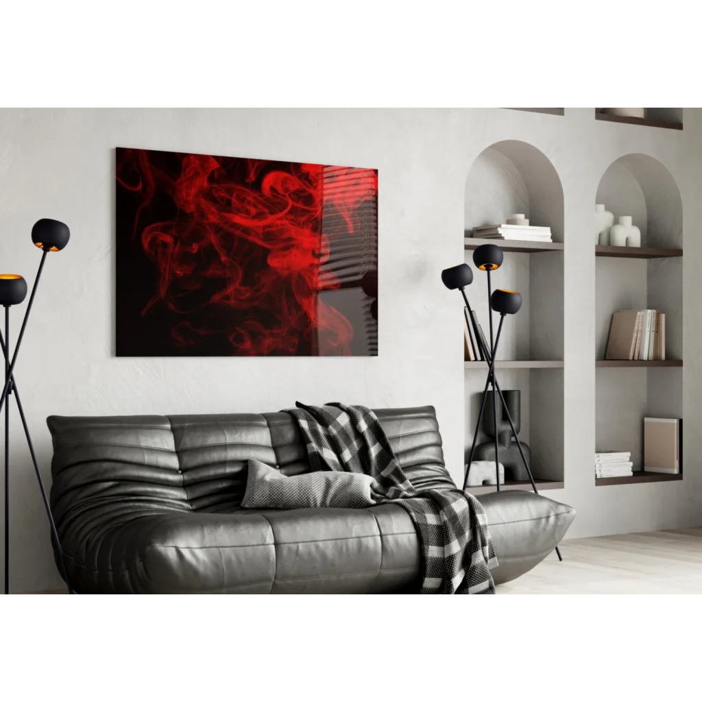 Black leather sofa with gray plaid throw and red smoke canvas wall art