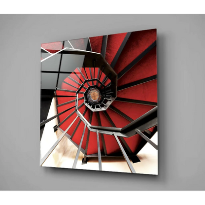 Red and black spiral staircase glass wall art on gray wall