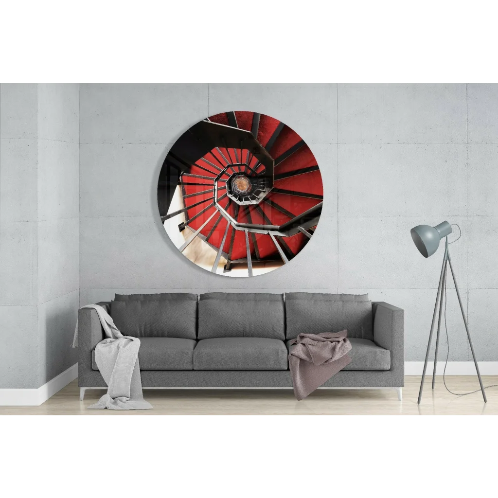 Bold red spiral staircase in tempered glass art with black railings