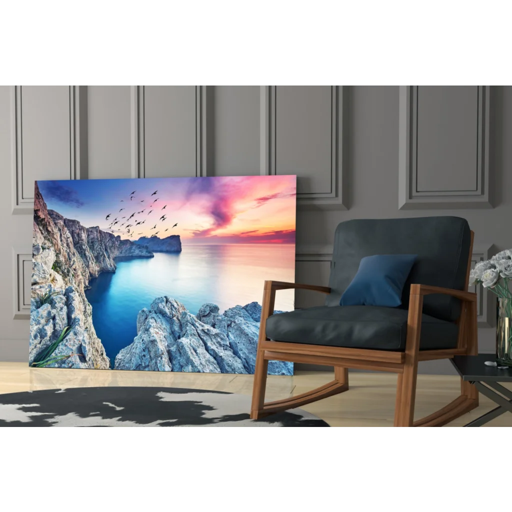 Vibrant coastal sunset glass wall art with cliffs, waters, and birds