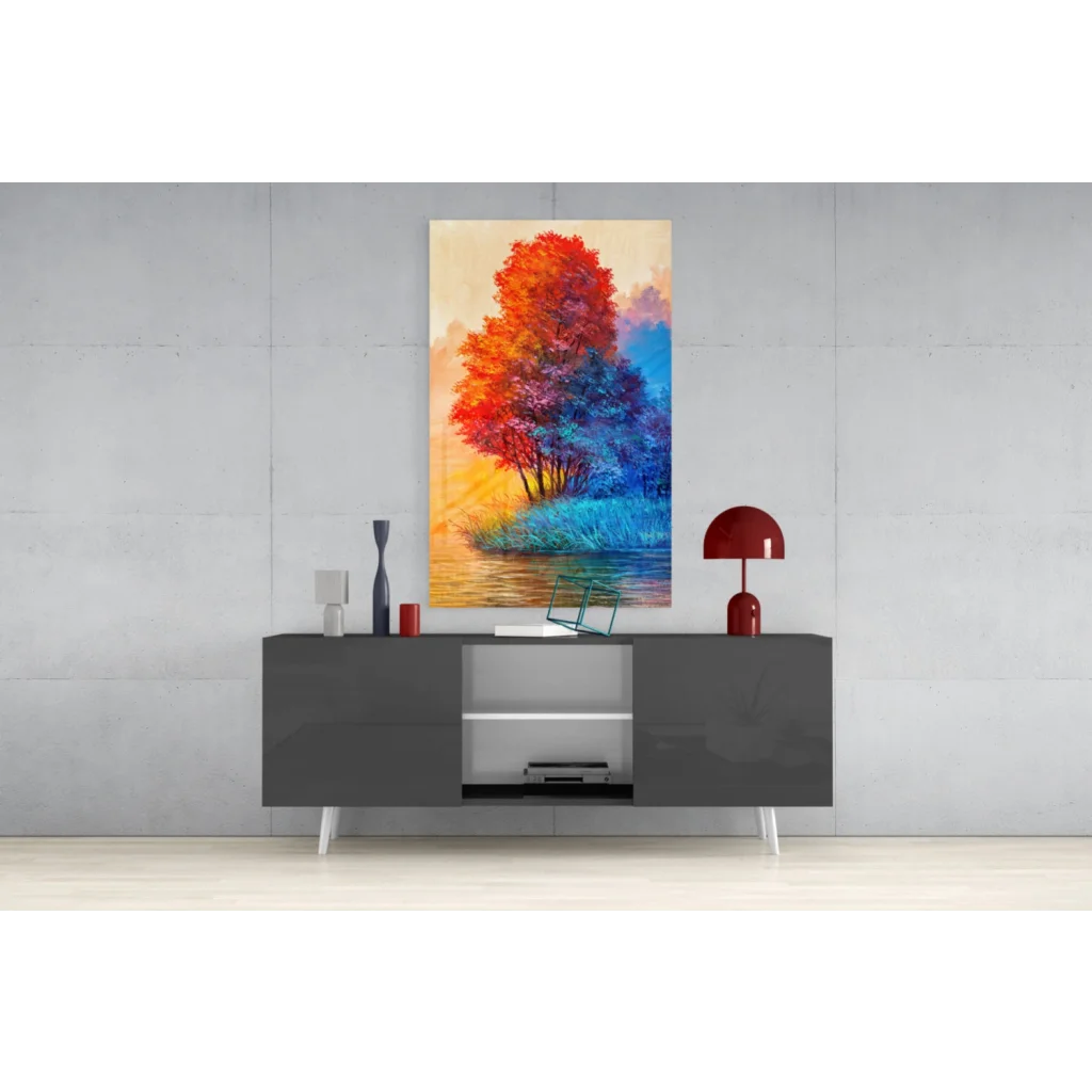 Fiery tree glass wall art with orange-blue foliage in water reflection