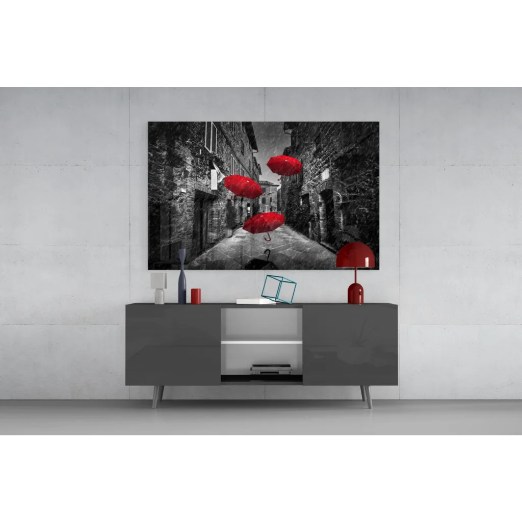 Vibrant red umbrellas in black-and-white cobblestone alley wall art