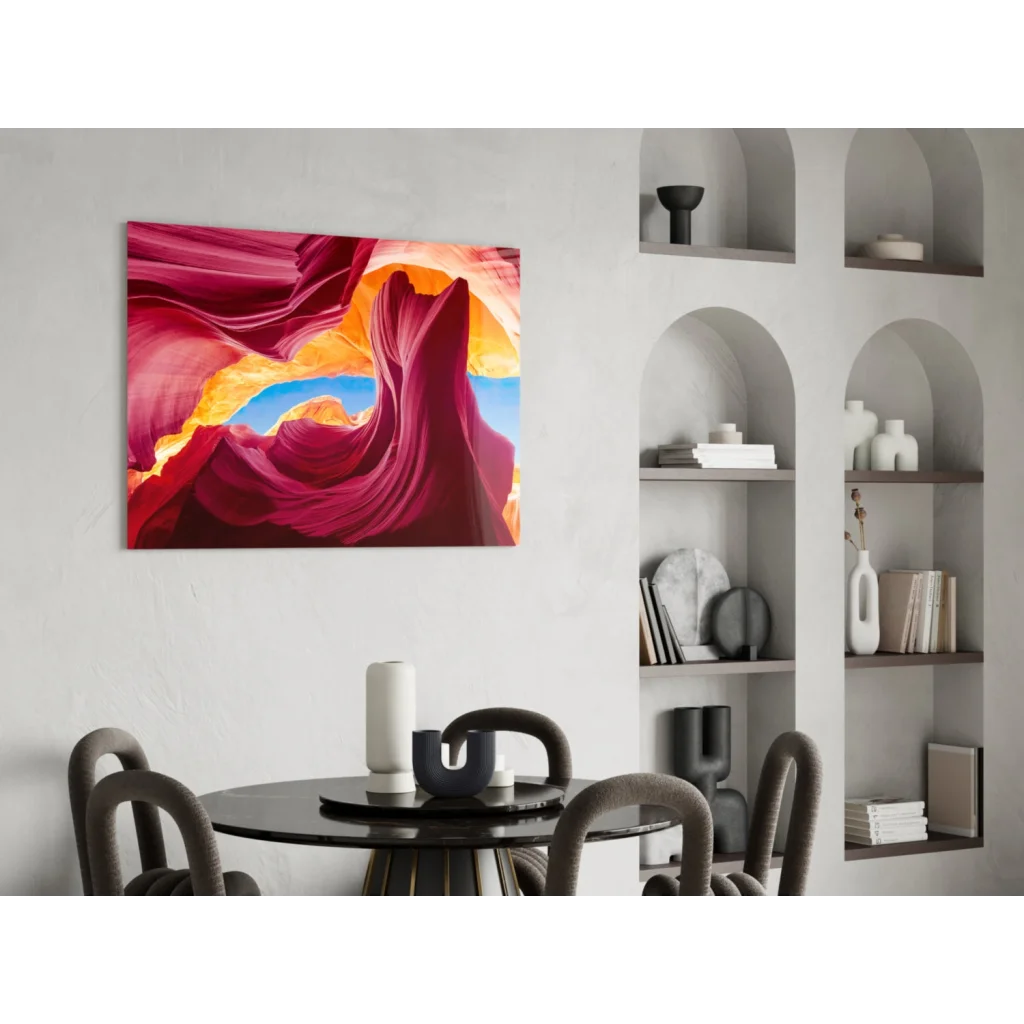 Vibrant glass wall art of red canyon with swirling blues and oranges