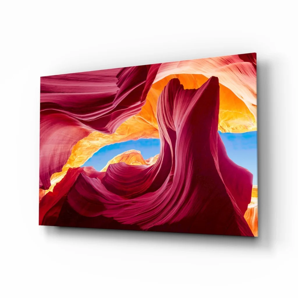 Vibrant red orange sandstone canyon glass wall art with blue sky archway