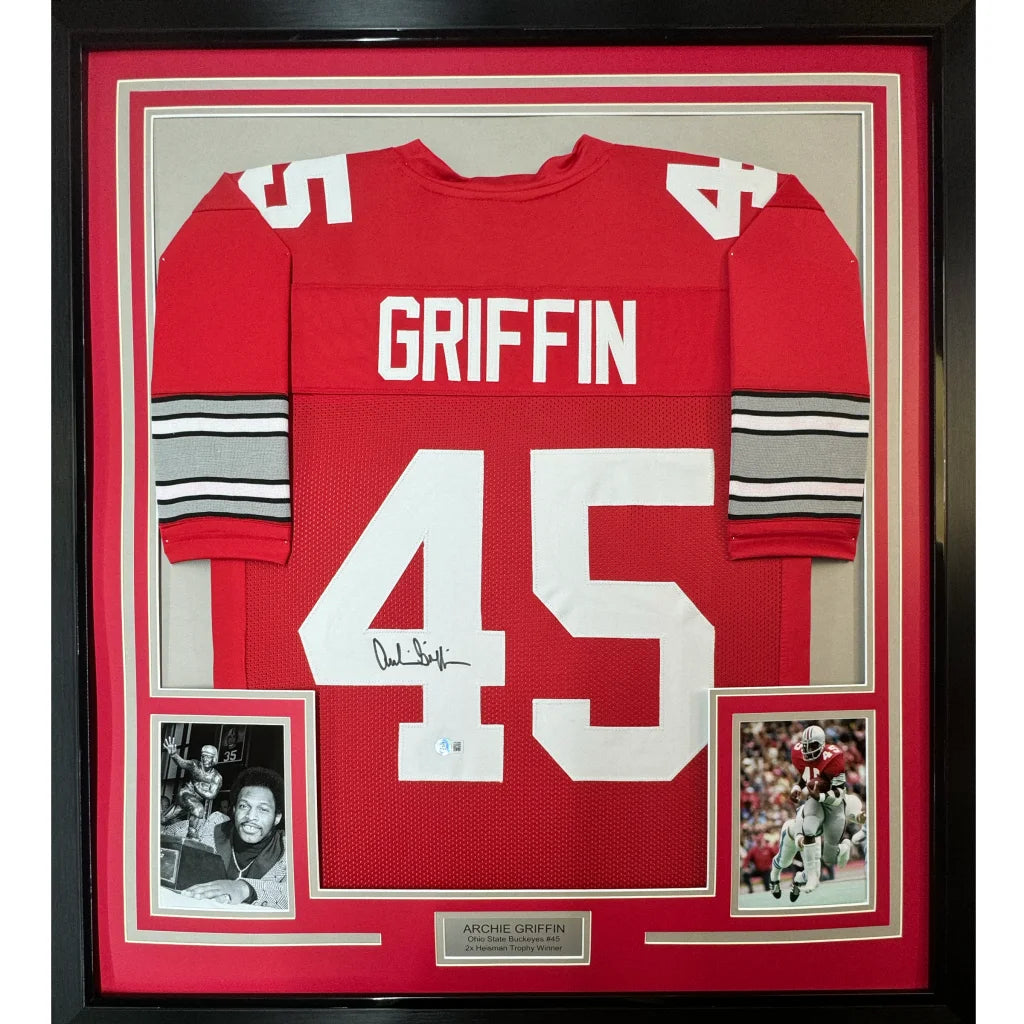 Framed red football jersey with white lettering and polka dots
