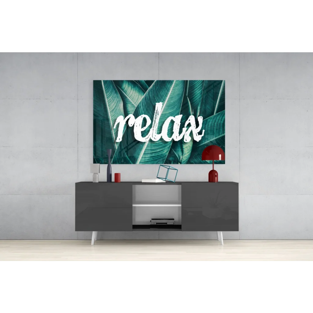 Teal tropical relax glass wall art with bold white relax lettering on leaves