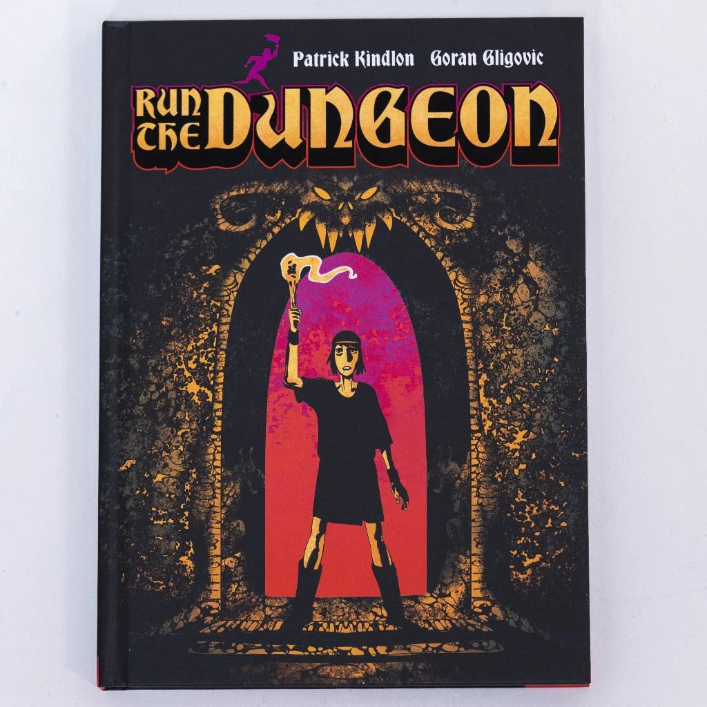 Relst Deluxe Edition with Self Defense Family Vinyl featuring a graphic novel with a black cover and a character holding a torch at a dungeon entrance