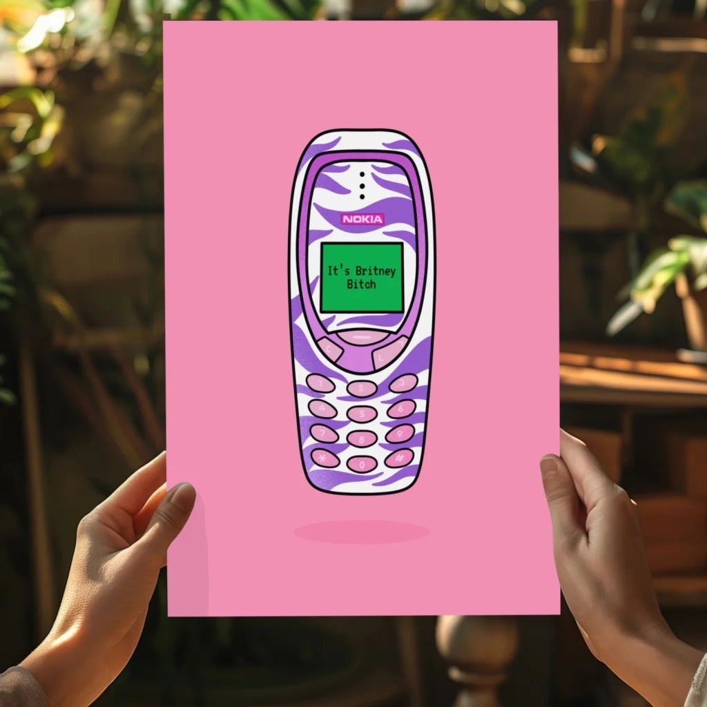 Vibrant zebra-print Nokia 3310 on insigne aluminum print with Britney quote