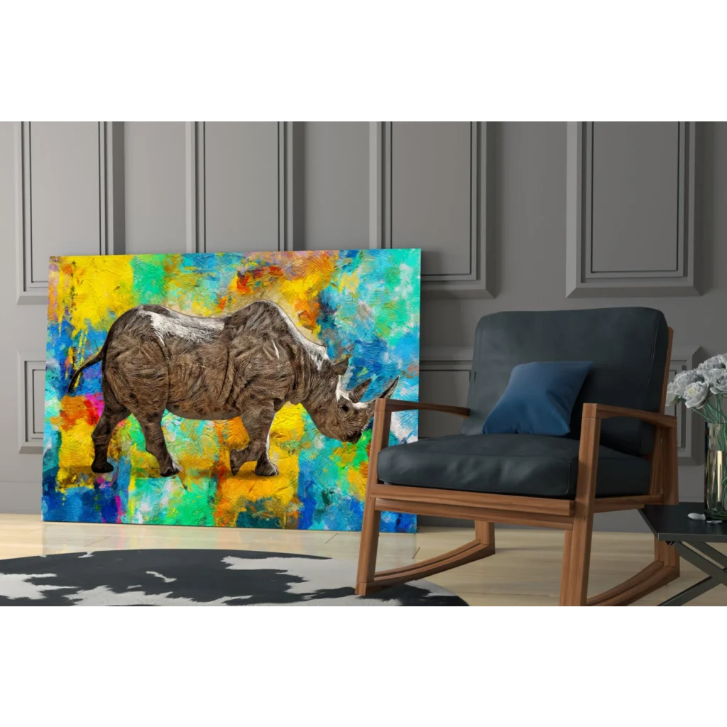 Vibrant rhino glass wall art with bold abstract yellow blue green splashes