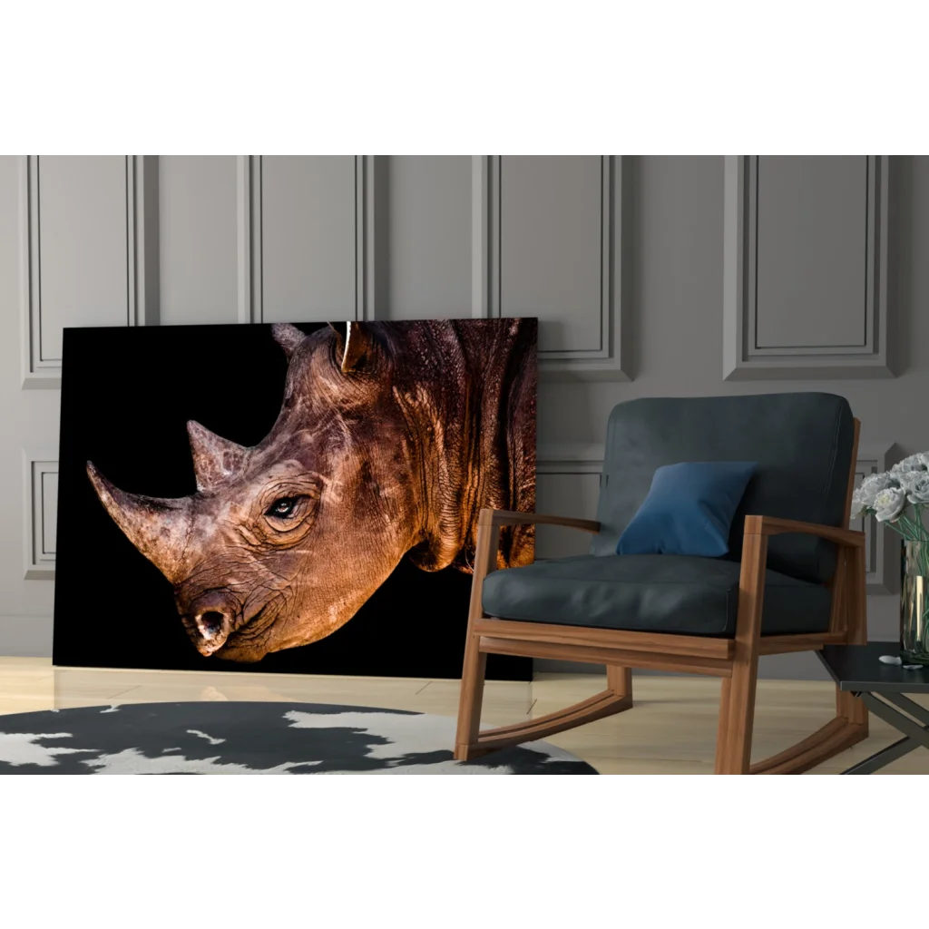 Majestic rhino close-up on black-gold glass wall art canvas print
