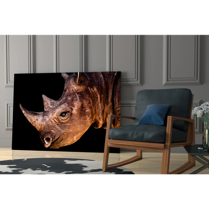 Majestic rhino close-up on black-gold glass wall art canvas print