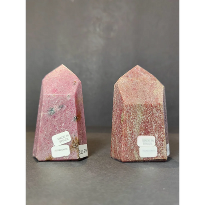 Two pink rhodochrosite polished obelisks with faceted points and natural color variations obelisk tower sculpture